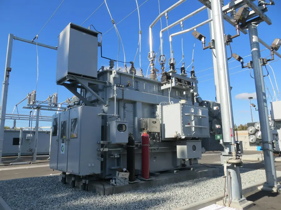 Oil-filled power transformer in a gravel substation yard